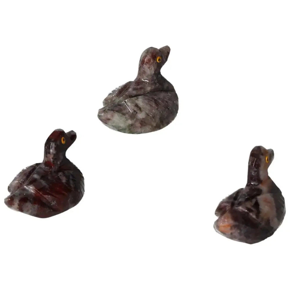 Carved magnesite duck sculptures in various angles, enhancing room aesthetics with calming crystal energies. Perfect for meditation spaces.