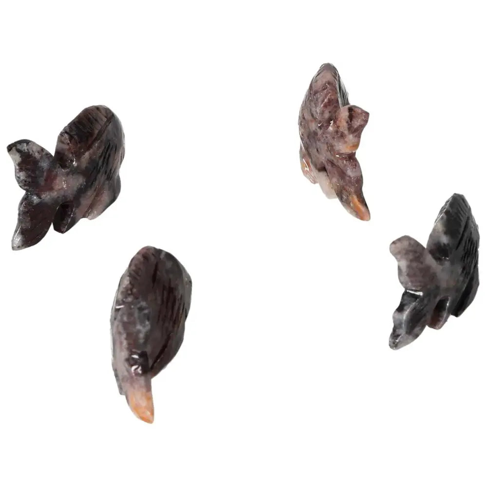 Exquisite carved magnesite fish sculptures enhancing meditation and peace by Sylvia Crystals, ideal for tranquility and inspiration.