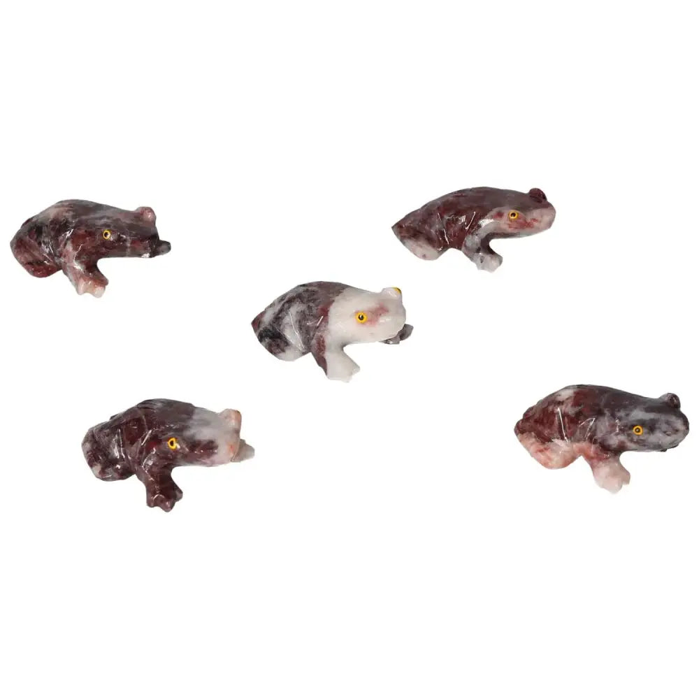 Five carved magnesite frog figurines by Sylvia Crystals, showcasing intricate craftsmanship and spiritual tranquility benefits.