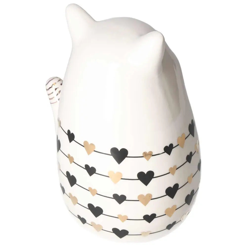 Elegant white ceramic cat decoration adorned with black and gold heart pattern, embodying harmony and luxury from Sylvia Crystals.