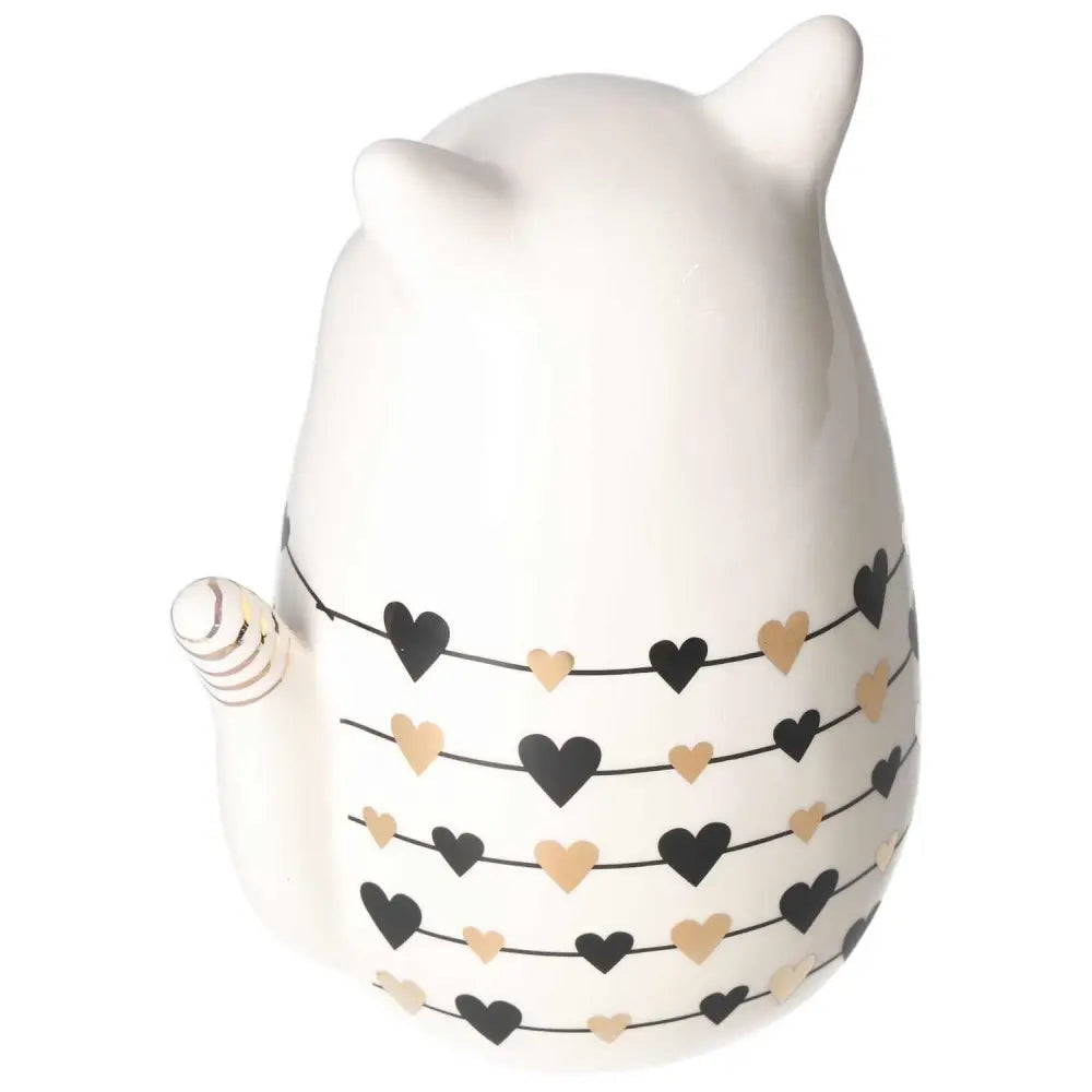 White ceramic cat decoration with black and gold heart patterns, embodying harmony and luxury from Sylvia Crystals.