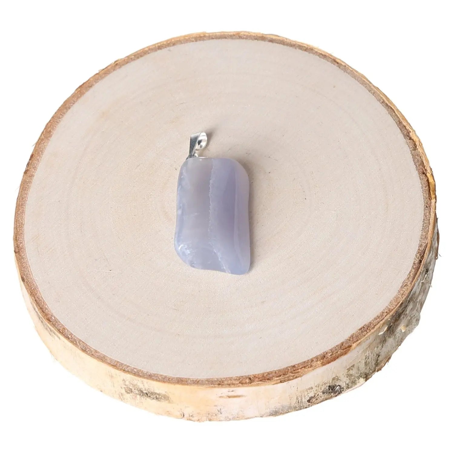 Chalcedony AA tumbled pendant on wooden slice, showcasing calming hues and natural beauty, perfect for elegant and tranquil jewelry wear.