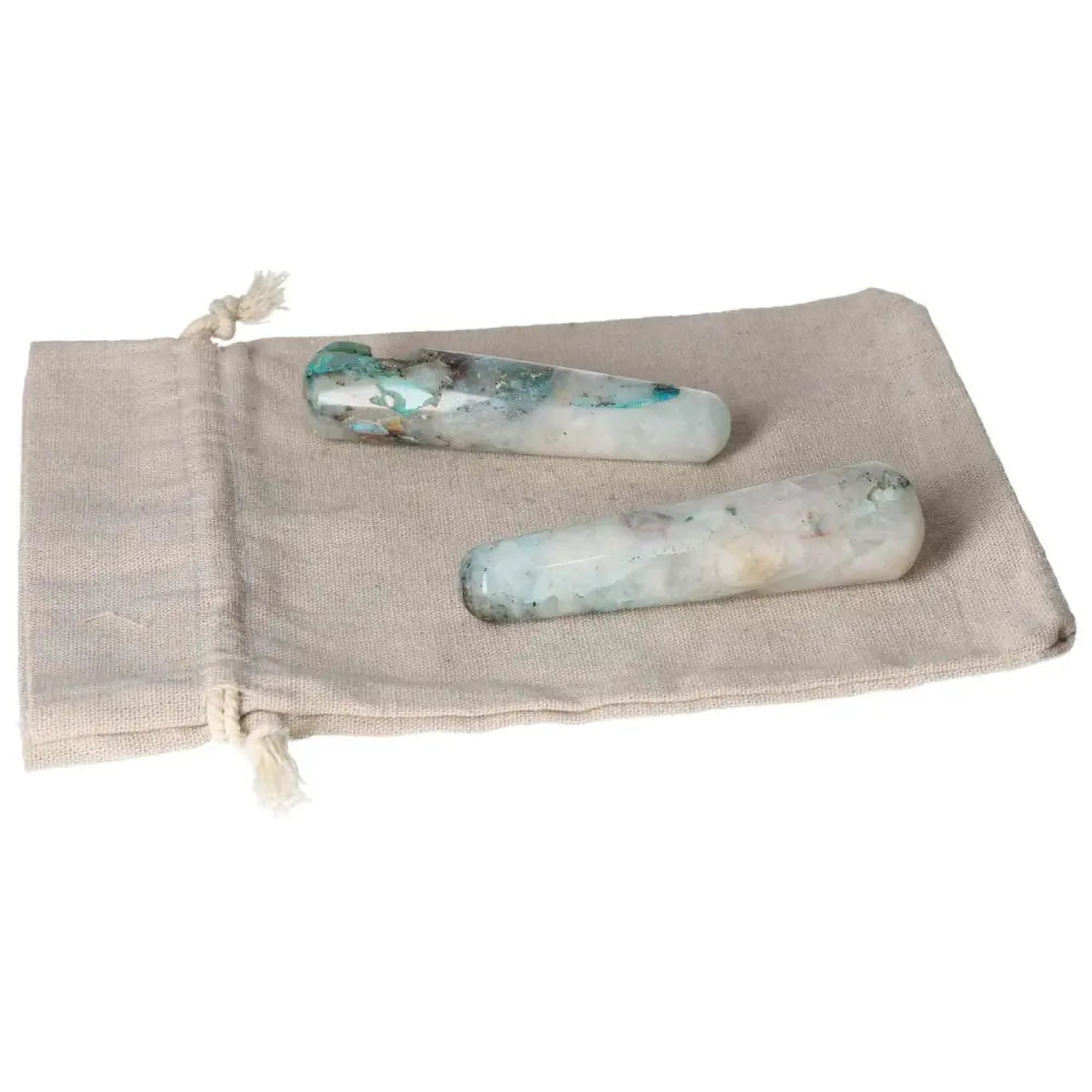 Chrysocolla wands on a linen pouch, known for enhancing communication and female energy, ideal for speakers and emotional insight.