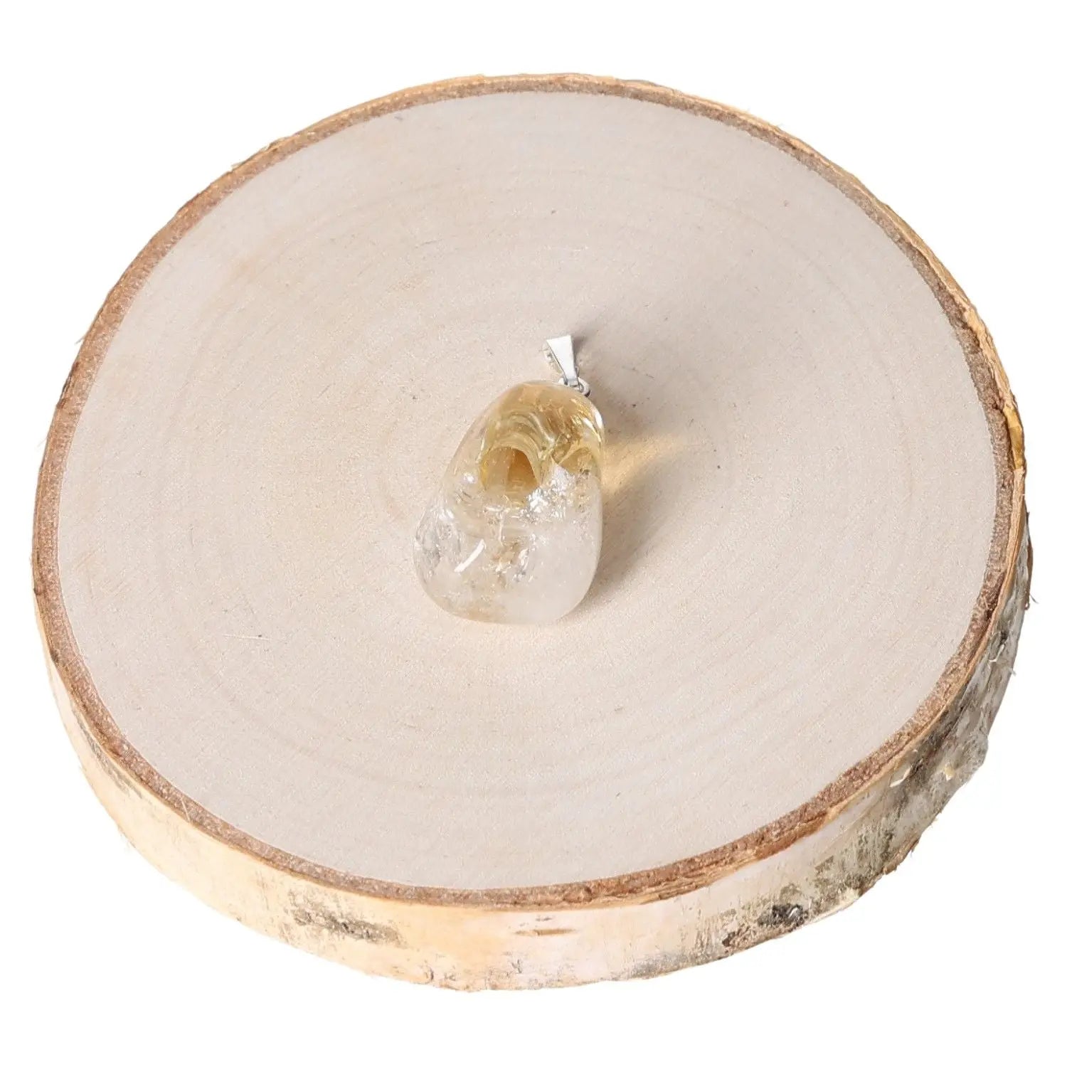 Citrine Quartz Tumbled Pendant on natural wood display, showcasing its radiant golden hues and smooth, polished surface.