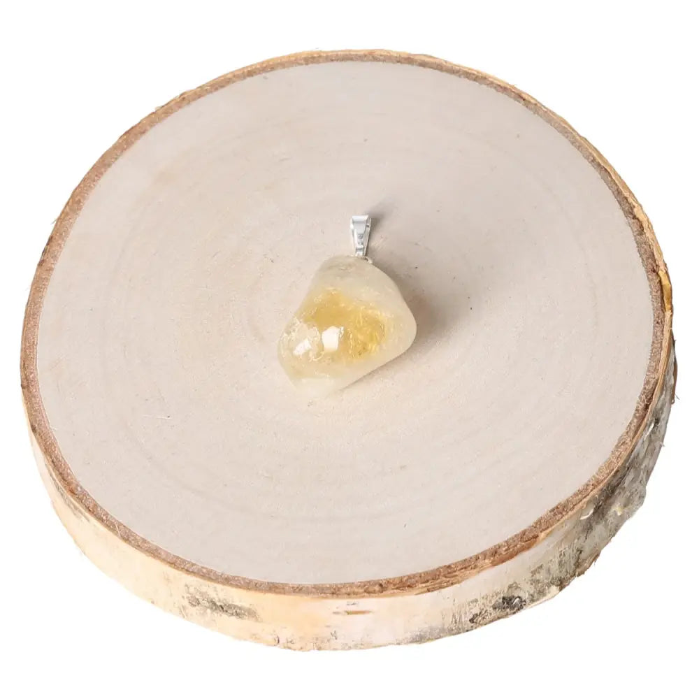 Citrine Tumbled Pendant with golden crystal on a wooden slice