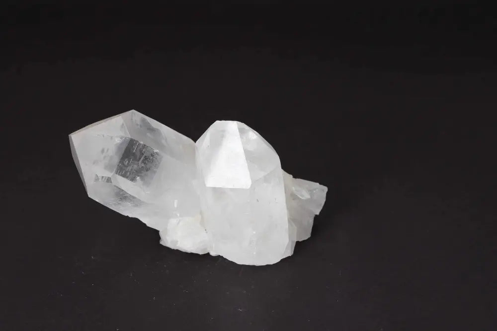 Clear Quartz Cluster showcasing natural crystal formations with multiple points on a shared matrix, amplifying purity and energy.
