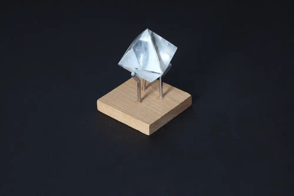 Clear Quartz Double Pyramid on a wooden base, 3 cm. A calming stone used for purification and neutralizing negative vibrations.