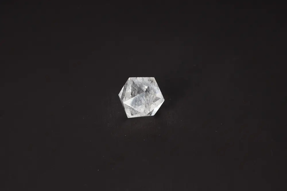 3 cm Clear Quartz Geometric Sphere on dark background, promoting purification and balance, ideal for neutralizing negative energy and radiation.
