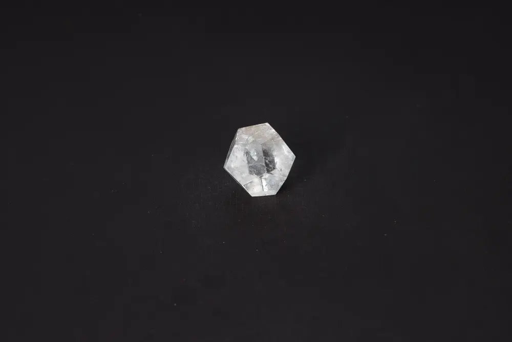 Clear Quartz Geometric Sphere 3 cm on black background, ideal for purification and harmonizing energy, absorbs negative vibrations and radiation.
