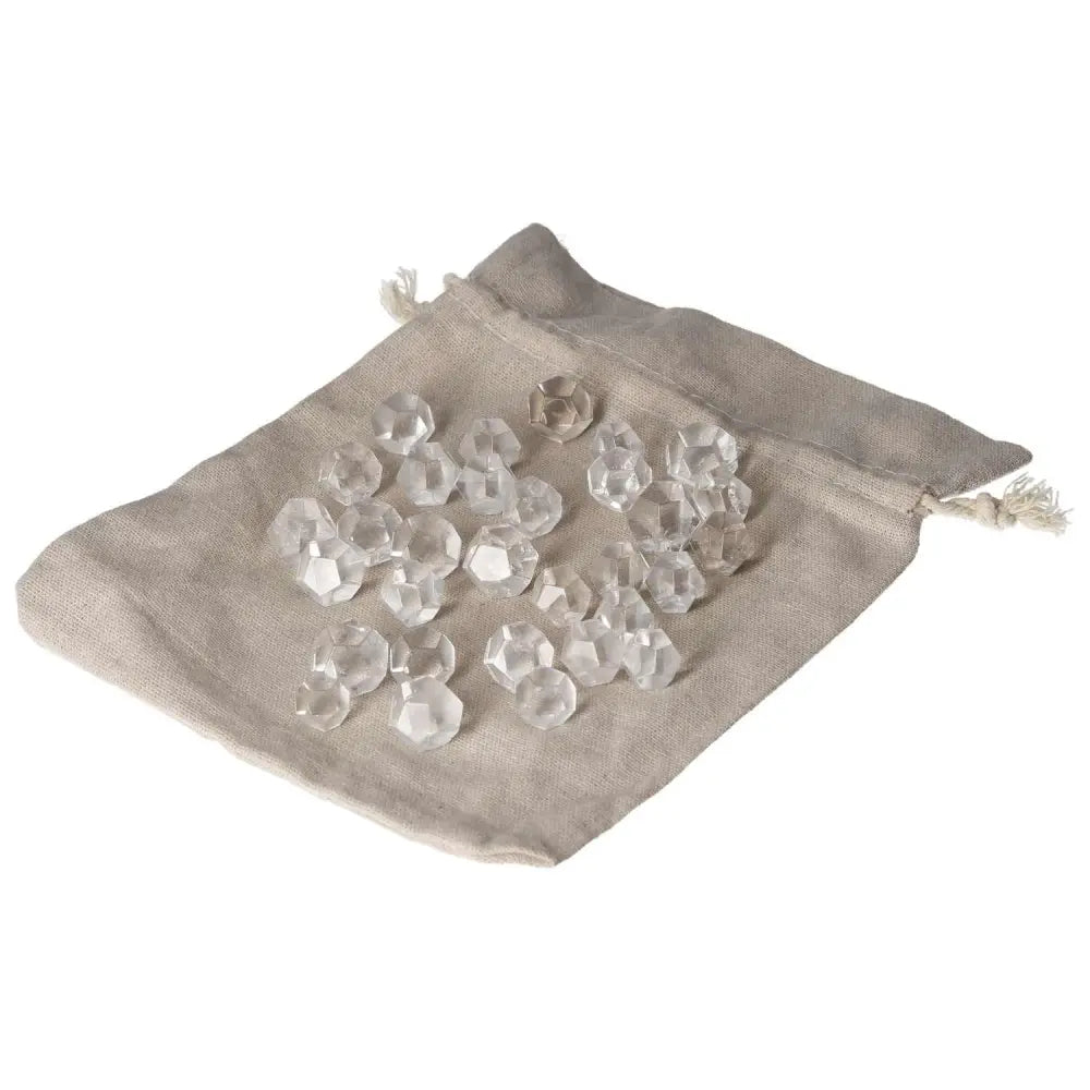 Clear quartz small geometric spheres in a cloth bag, ideal for purification and harmonizing energies.