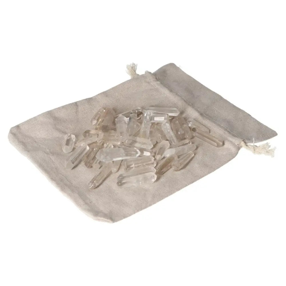 Clear Quartz Small Stics in a beige pouch, ideal for purification and harmonizing energy, perfect for neutralizing negative vibrations.