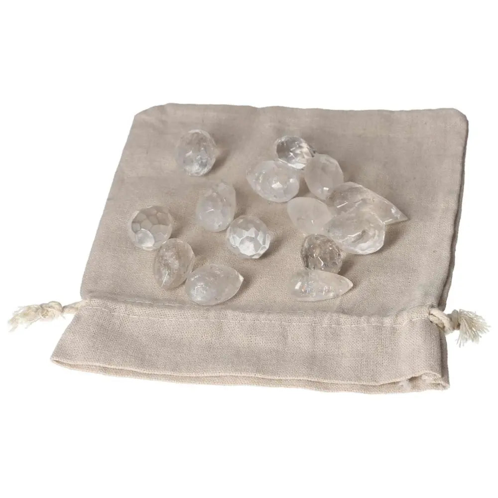 Clear Quartz small tear gemstones on fabric pouch for purification and harmonizing energy. Ideal for neutralizing negative vibrations.