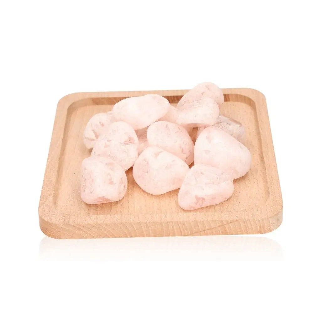 Smooth Emma Eggs, river-polished stones, on a wooden tray showcasing their natural beauty and calming energy properties.