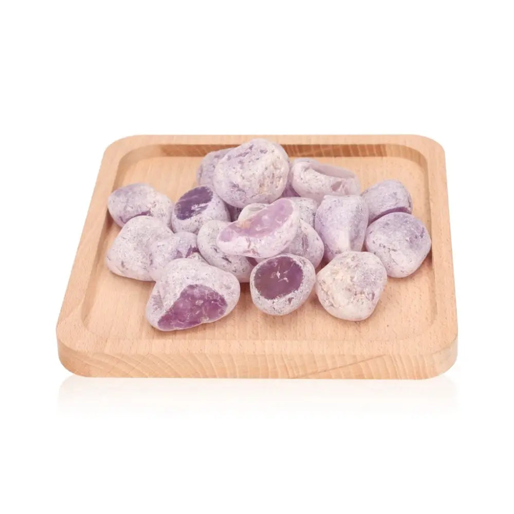 Wooden tray filled with smooth, purple Emma Eggs, natural river stones polished in New Zealand, made from jasper and agate.