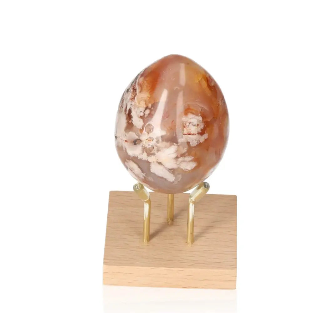 Flower Agate Egg on stand, perfect crystal for growth, healing, and positive energy with delicate blossom patterns.