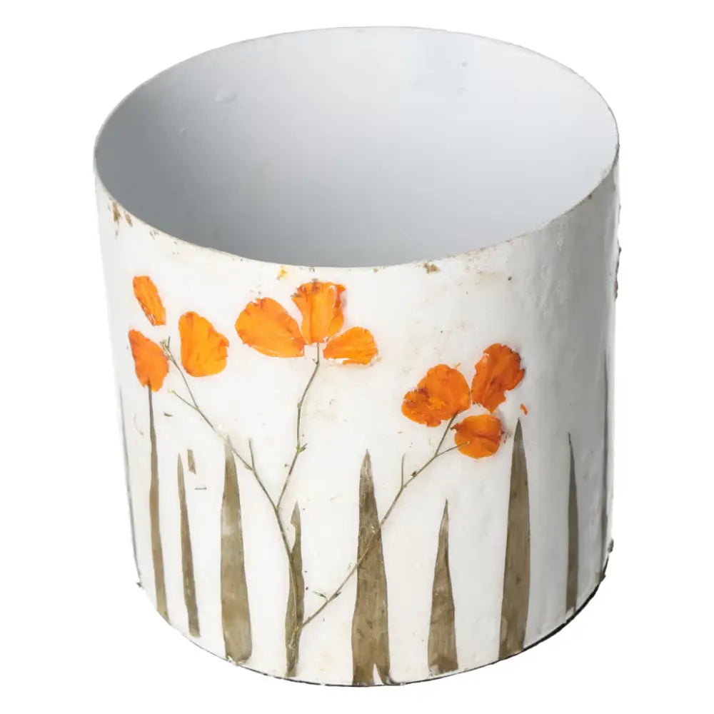 Elegant planter with intricate orange flower motifs, designed to enhance living spaces with luxury and conscious living philosophy.