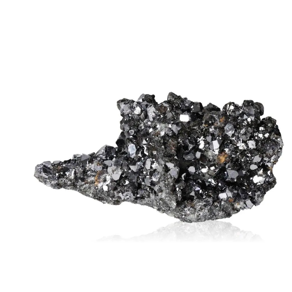 Galena crystal with reflective surface, known for grounding and spiritual transformation.