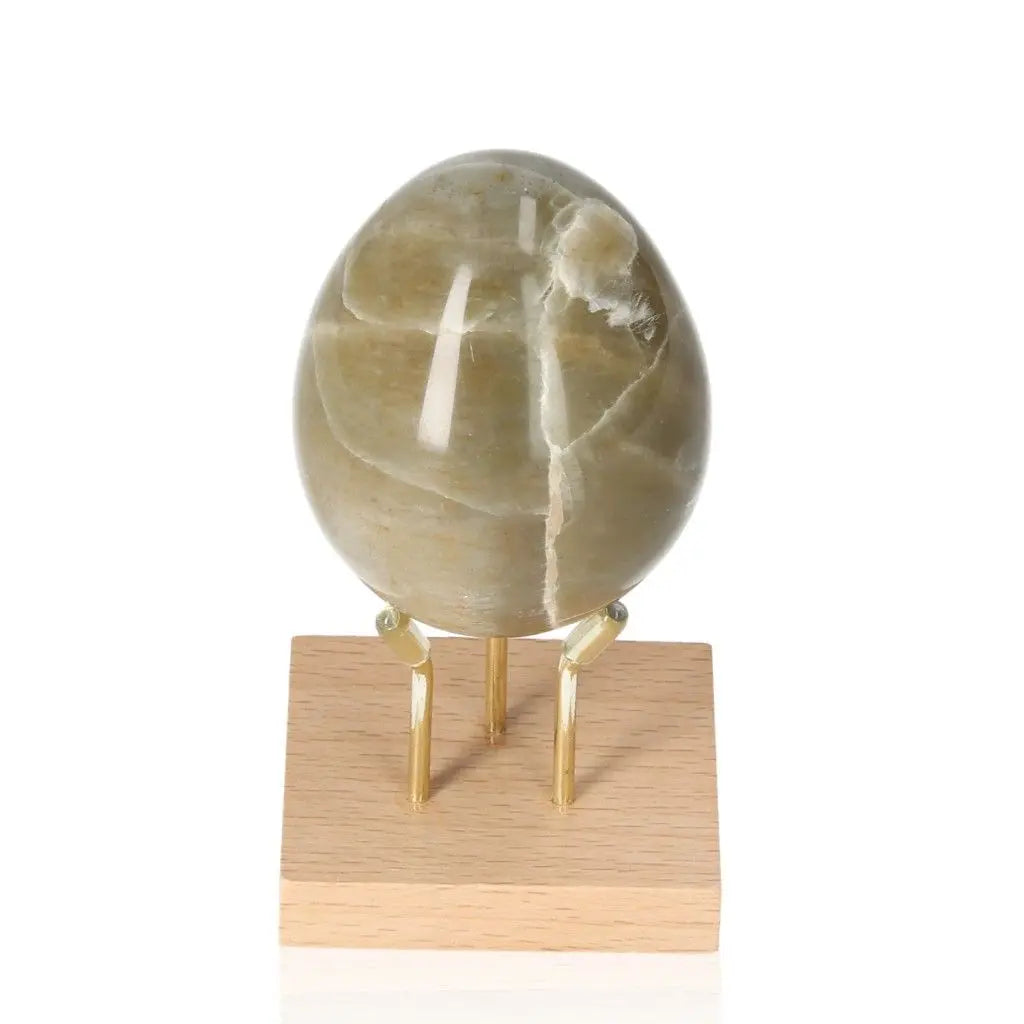 Garnierite egg on stand symbolizing prosperity, heart healing and abundance, activating the Heart Chakra for emotional balance and growth.