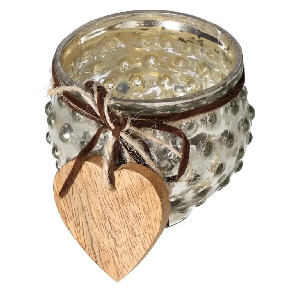 Glass lantern with wooden heart pendant, showcasing elegant design and luxury, ideal for serene and conscious living spaces.