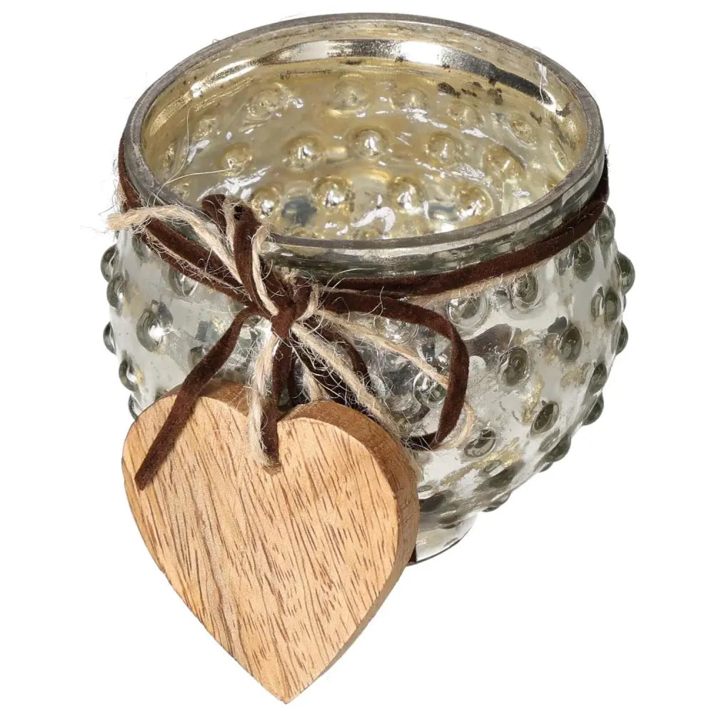 Glass lantern with wooden heart pendant, embodying luxury and elegance. Perfect decor piece for spirituality-conscious living.