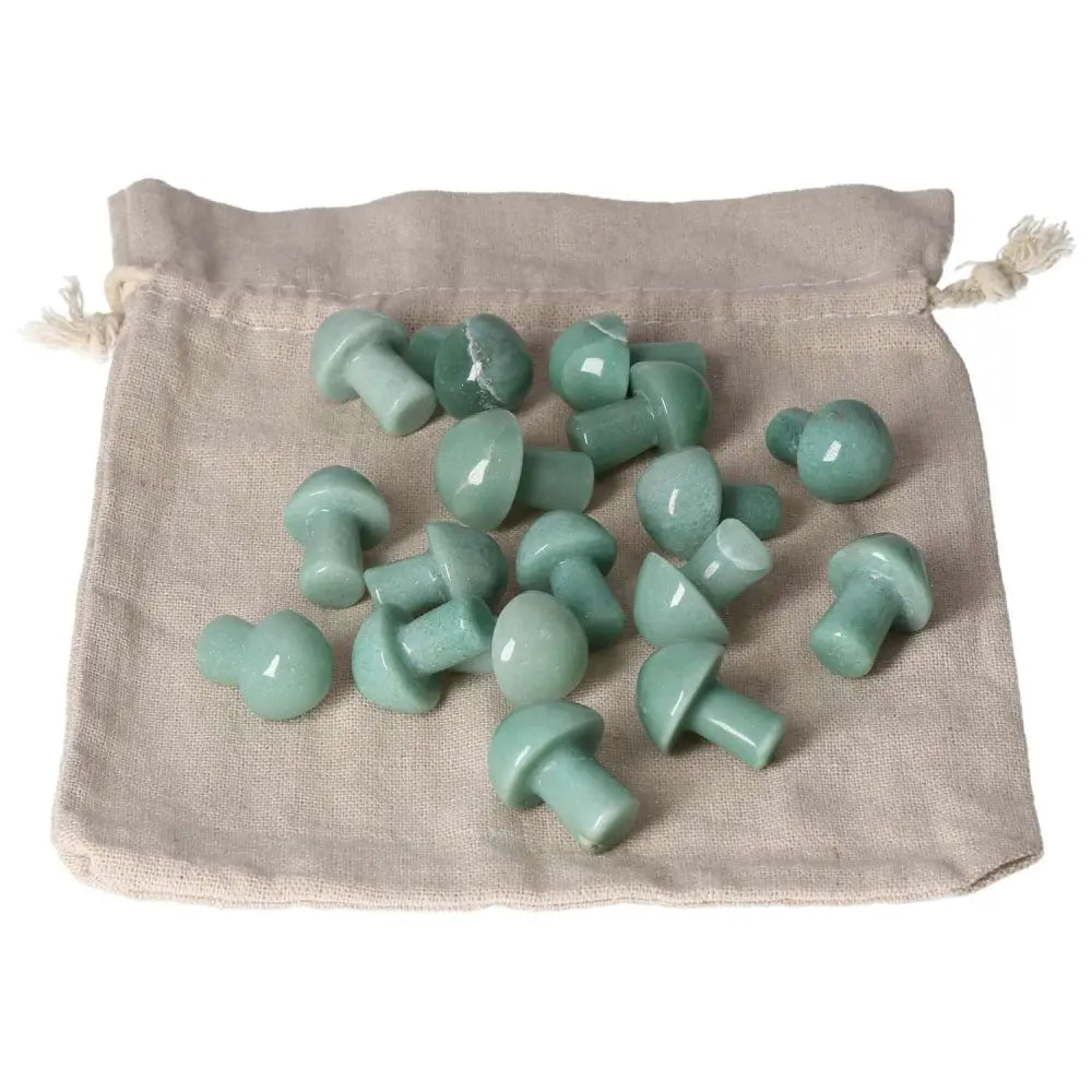 Green Aventurine small mushroom crystals on a pouch, known for boosting self-confidence, bringing luck, and promoting inner peace.