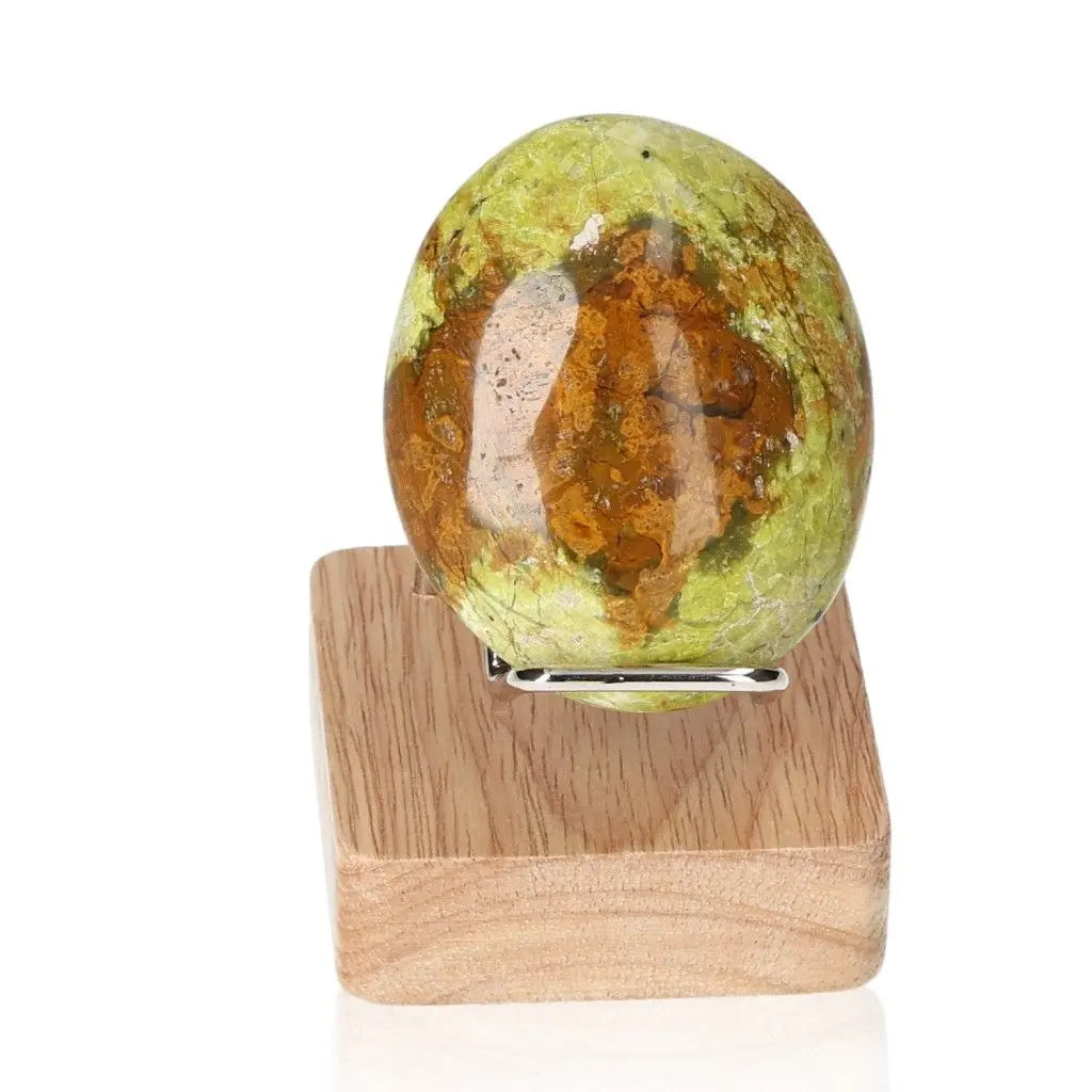 Green Opal Freeform stone on wooden stand, showcasing calming green hues for emotional balance and healing.