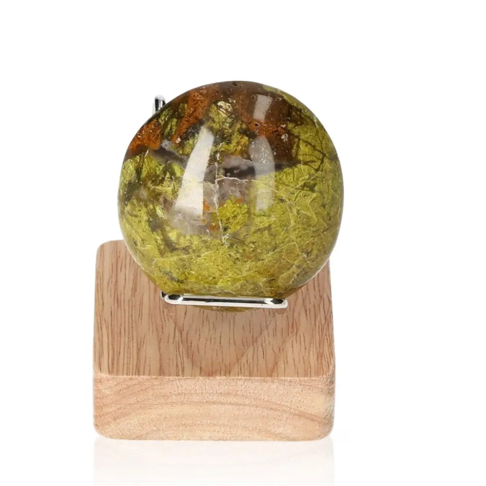 Green Opal Freeform on wooden stand, showcasing soft green hues and healing properties for emotional balance and renewal.