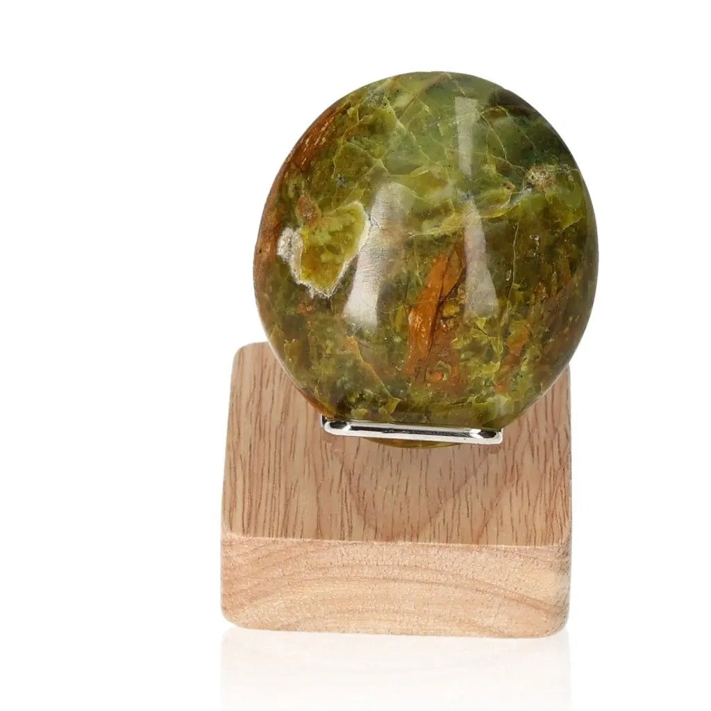 Green Opal Freeform on wooden stand, known for soothing energy, renewal, and emotional healing properties.