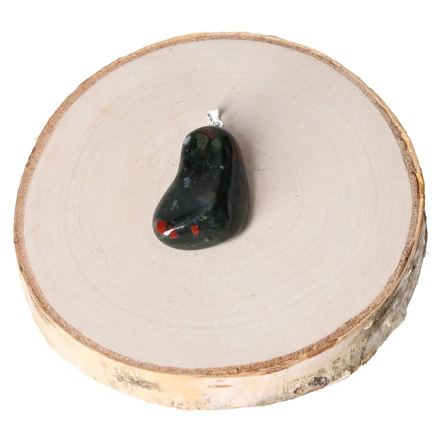 Heliortope Tumbled Pendant with vibrant hues on wood display, symbolizing elegance and spiritual harmony. Perfect for versatile wear.