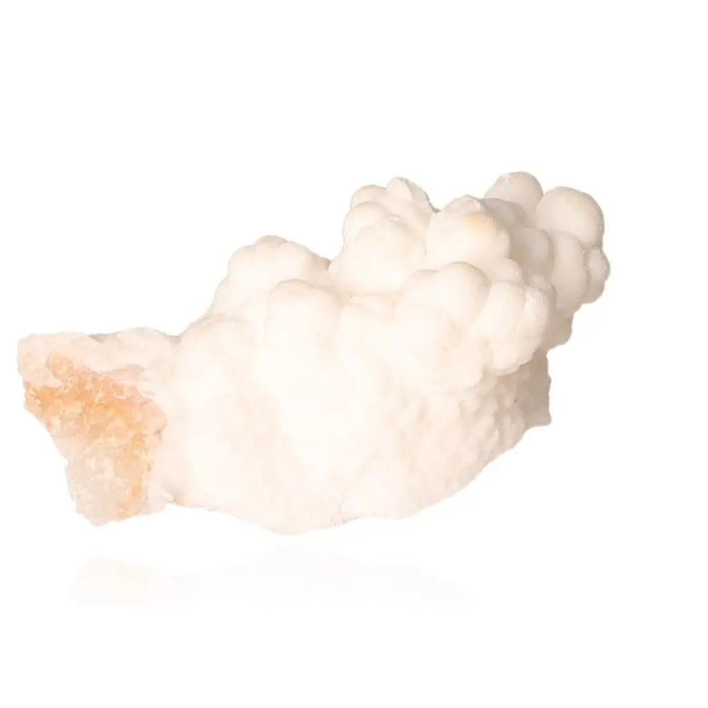 Ighoud Calcite Druze mineral from Morocco featuring natural white formations and earthy tones, symbolizing stability and transformation.