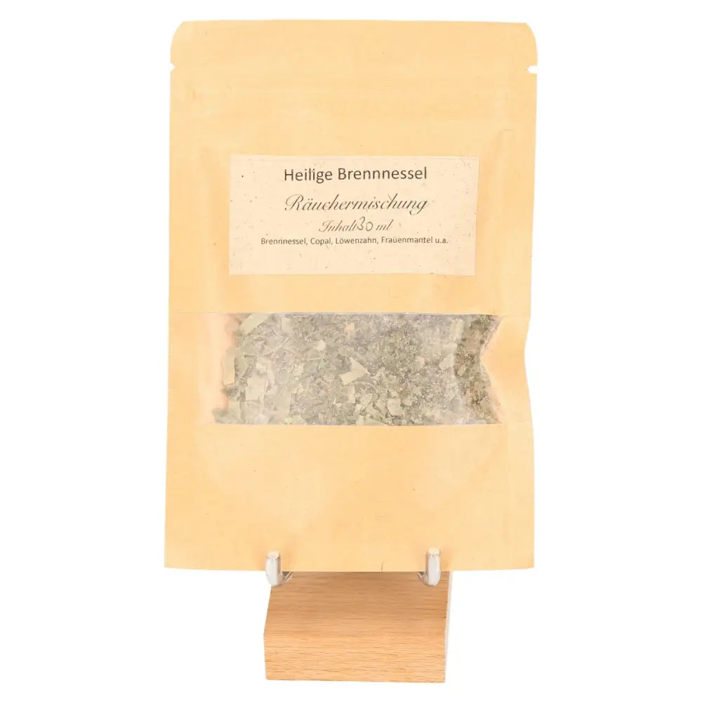Sacred Nettle incense blend for holistic well-being in a brown bag on a wooden stand, offering protective and cleansing benefits.