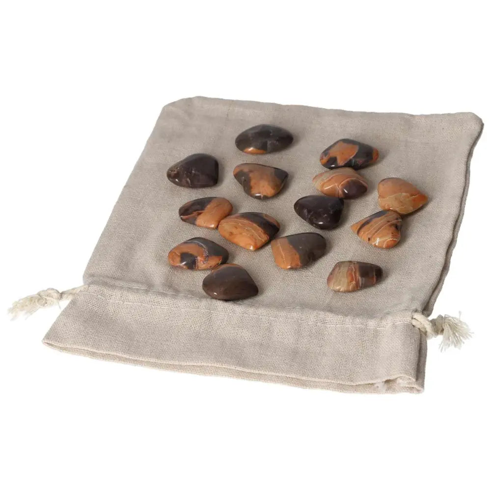 Jasper Tiger small heart stones on a linen pouch promoting harmony, peace, and positive energy for improved well-being.