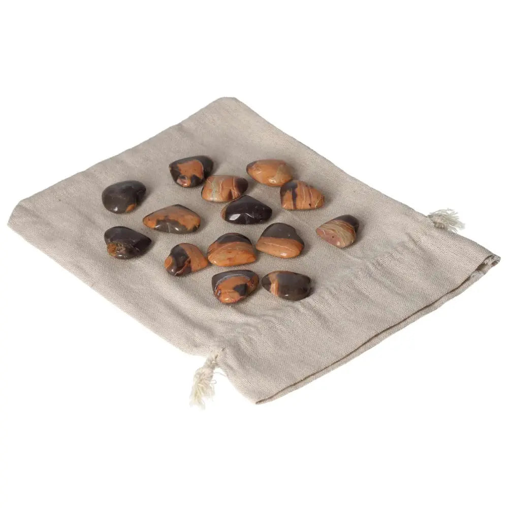 Collection of Jasper stones on a fabric pouch, promoting harmony, peace, and balance in life, enhancing well-being and inner strength.