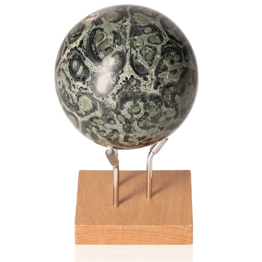 Kambaba Jasper Sphere on stand showcasing green and black patterns, symbolizing tranquility, grounding, and connection to Earth energies.