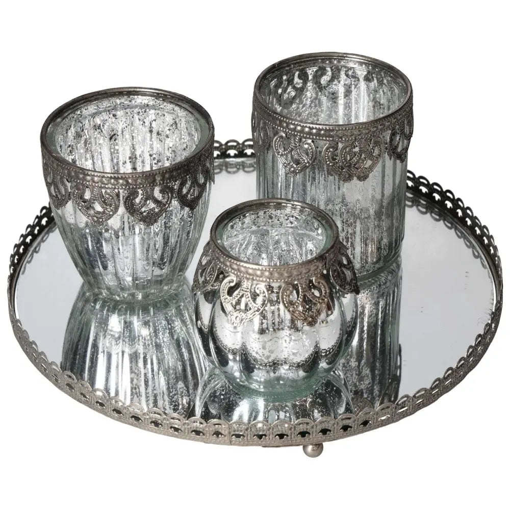 Elegant lantern set on silver-rimmed mirror tray, showcasing luxury decor from Sylvia Crystals.