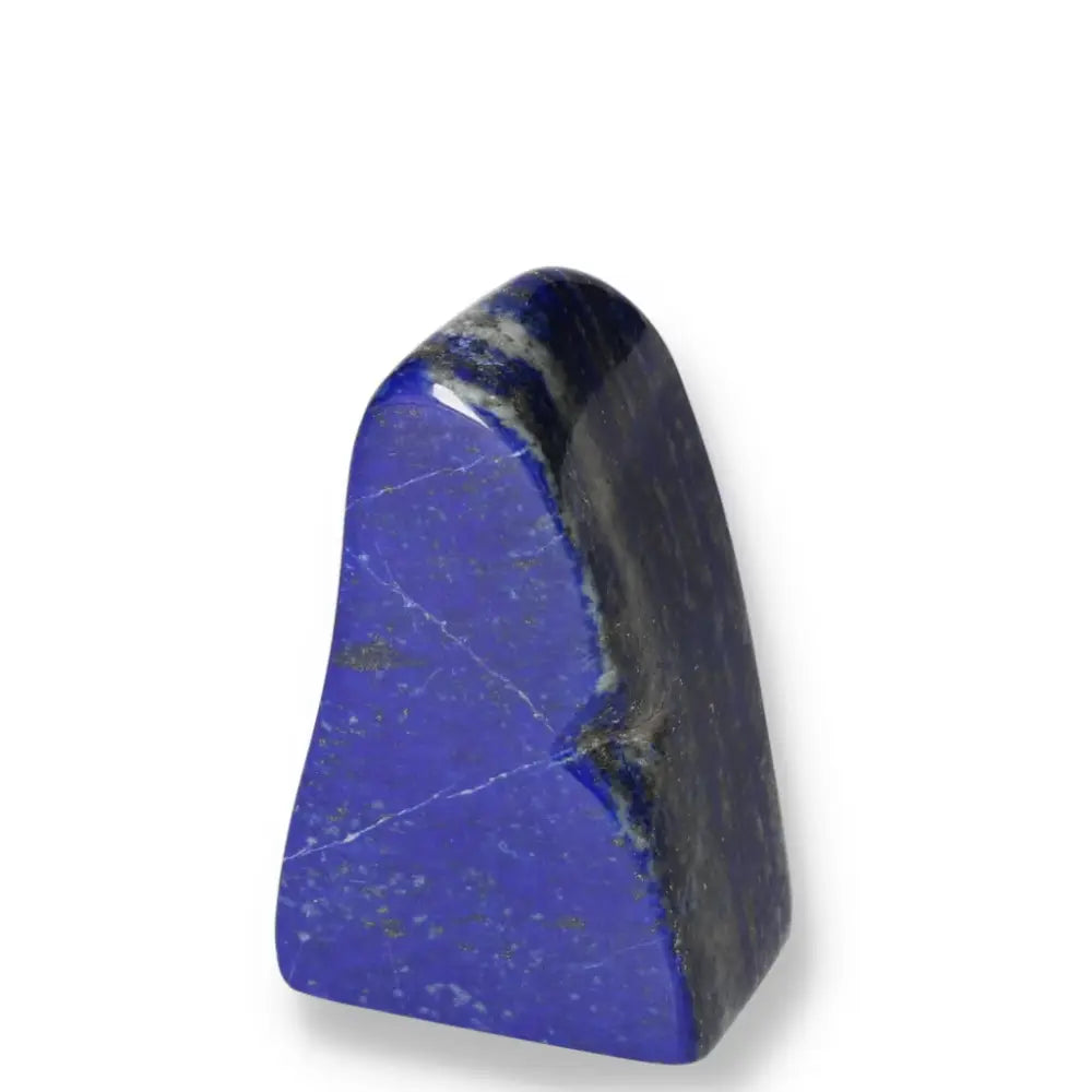 Lapis Lazuli freeform with deep blue hues and golden flecks, showcasing Pakistani craftsmanship, symbolizing wisdom and power.