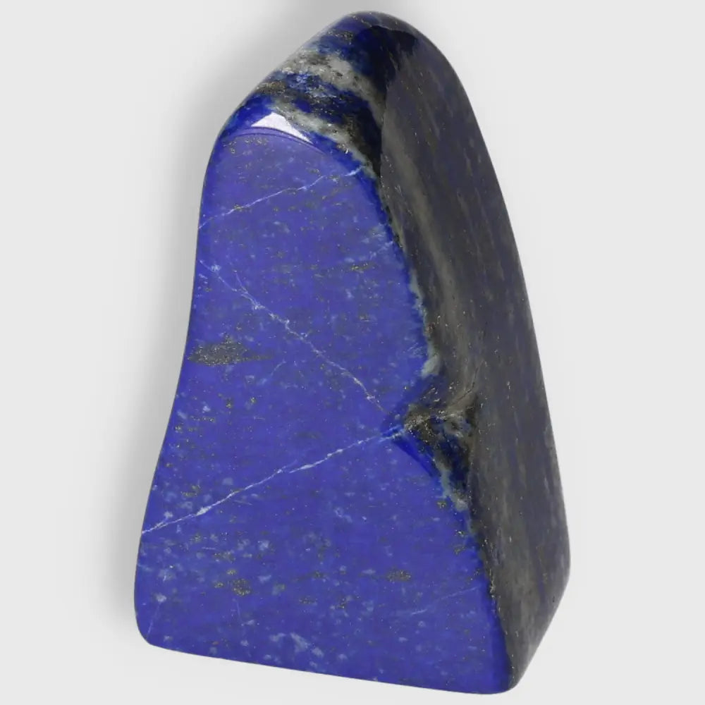 Lapis Lazuli Freeform from Pakistan, deep blue with golden pyrite flecks, symbol of wisdom and power, perfect for crystal collections.
