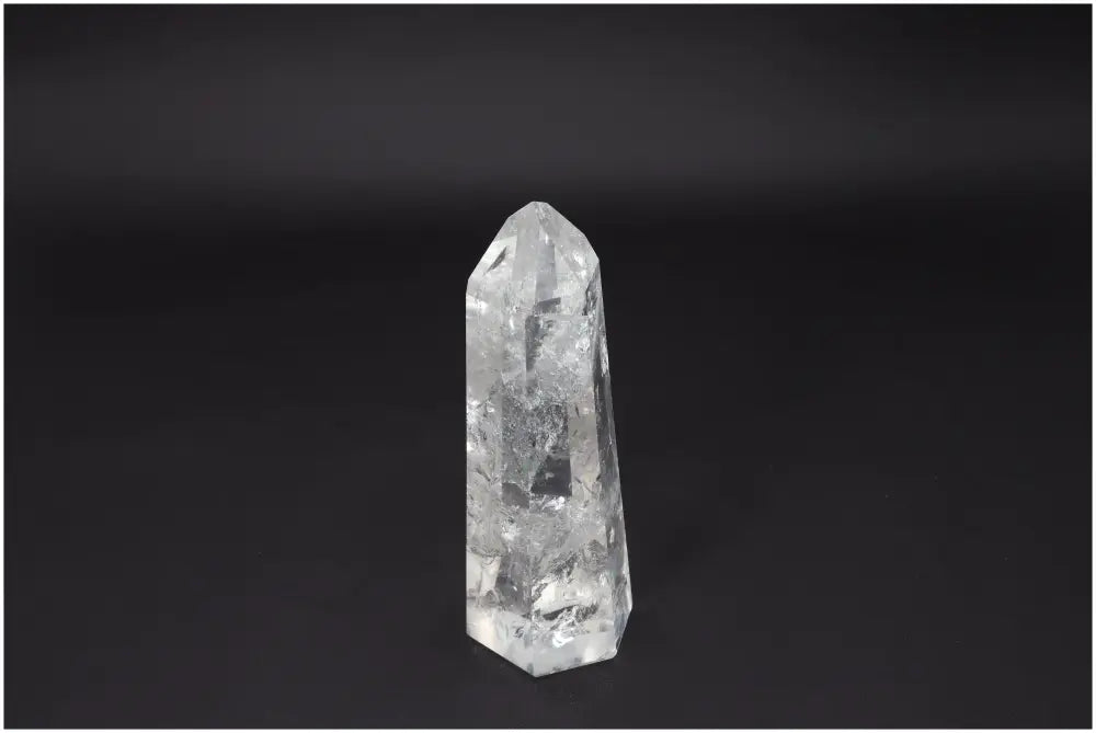 Large Lemurian Quartz Obelisk crystal against a black background, showcasing its clear, naturally formed structure for clarity and balance.