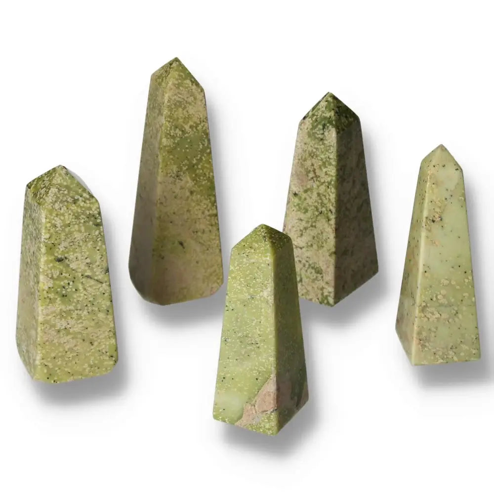 Five natural green serpentine obelisks showcasing various shades, ideal for meditation, healing, and decorative purposes.
