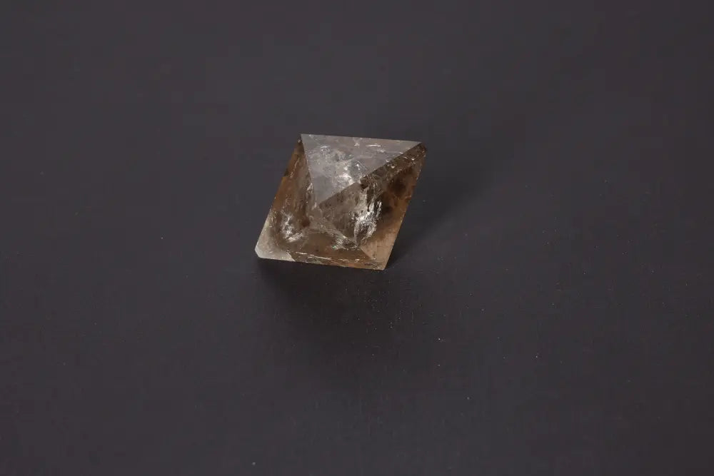 Lemurian Quartz Double Pyramid, 4 cm, featuring sacred geometry and ancient wisdom, against a dark background for spiritual connection.