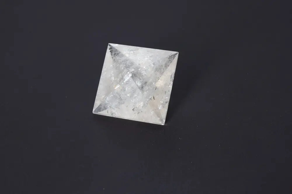 Lemurian Quartz Double Pyramid 5 cm with sacred geometry and ancient wisdom on a dark background.