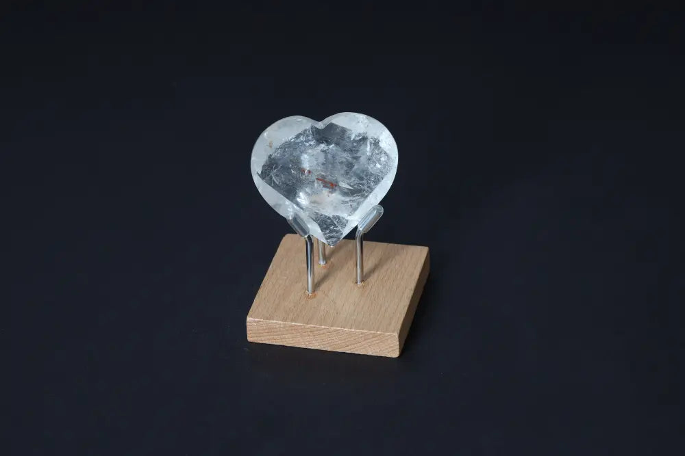 Lemurian Quartz Geometric Heart on stand, luxury crystal by Sylvia Crystals, known for purification and harmony properties.