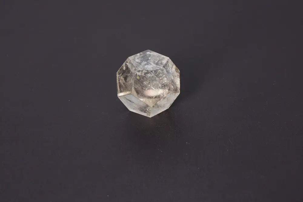 Lemurian Quartz Geometric Sphere 5 cm showcasing sacred geometry and ancient wisdom against a dark background.