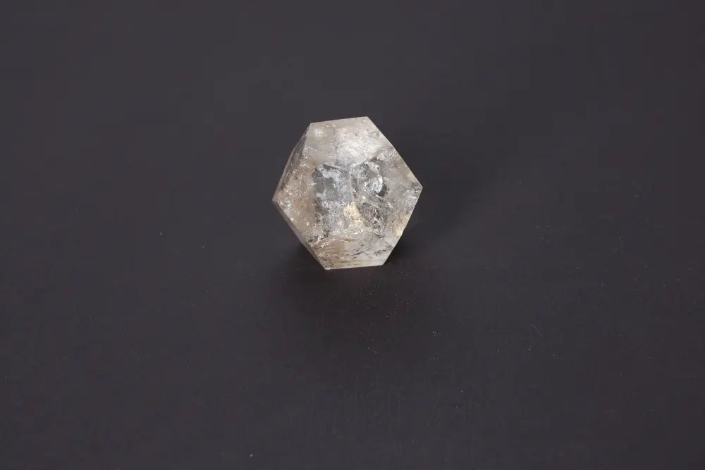 Lemurian Quartz geometric sphere on black background, showcasing ethereal clarity and sacred geometry for spiritual connection.