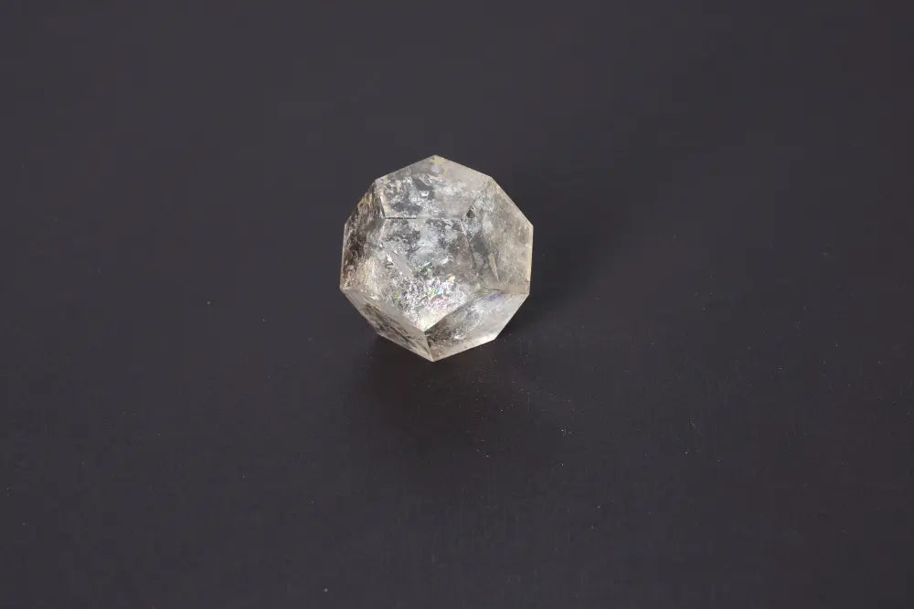 Lemurian Quartz Geometric Sphere 5 cm on dark background, showcasing sacred geometry and ethereal clarity for spiritual connection.