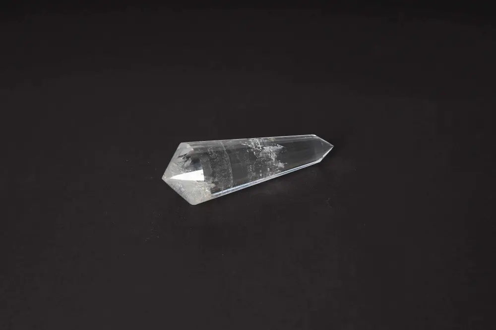 Lemurian Quartz Point crystal with distinct striations, embodying ancient wisdom from a mythical civilization; spiritual healing stone.