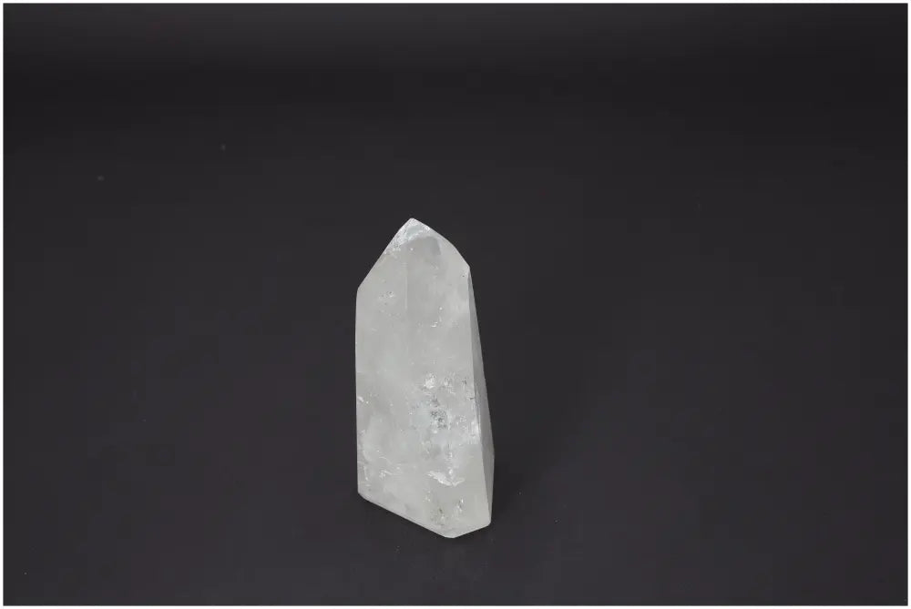 Lemurian Quartz Obelisk on black background, symbolizing spiritual purity and luxury. Crafted by Sylvia Crystals, perfect for harmonizing energies.