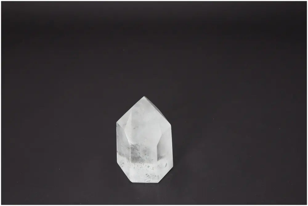 Alt Tag: Lemurian Quartz Obelisk from Sylvia Crystals, a premium gem for spiritual growth, harmony, and mindful living on a dark background.