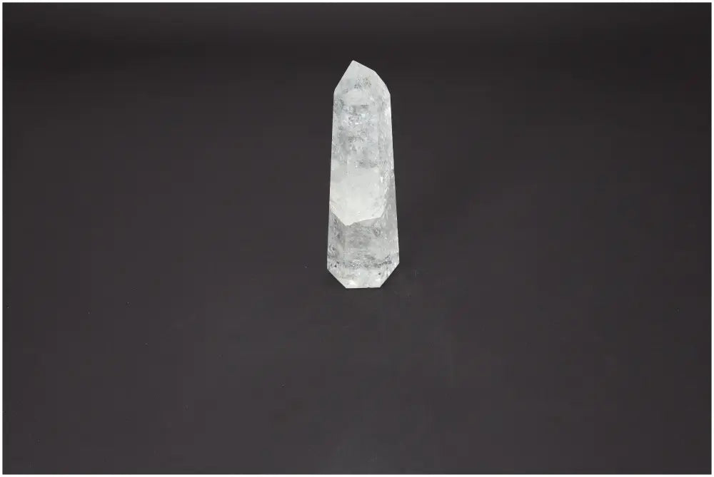 Lemurian Quartz Obelisk on black background, a premium crystal from Sylvia Crystals, known for purifying energy and neutralizing negativity.