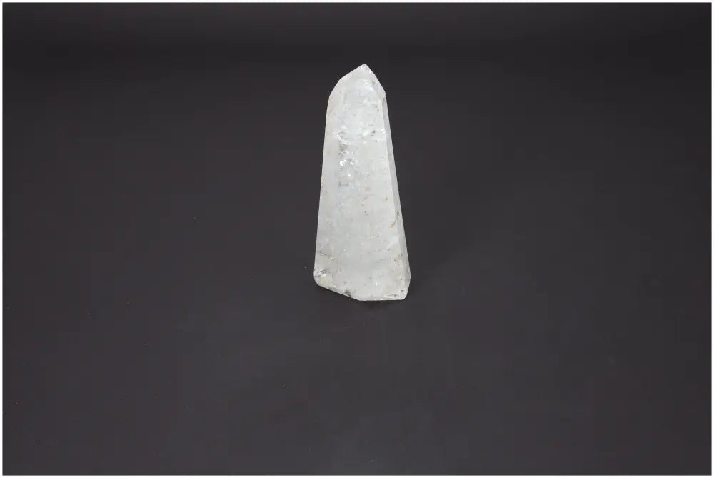 Lemurian Quartz Obelisk by Sylvia Crystals, premium energy harmonizing crystal against dark background.
